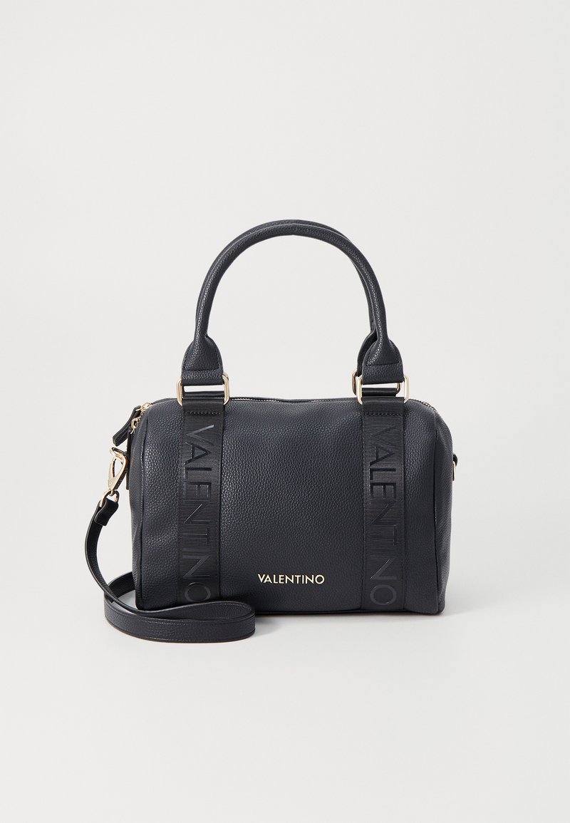 Navy leather handbag with dual top handles, detachable shoulder strap, embossed logo accents, and gold hardware details.
