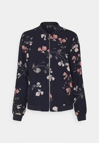 Floral bomberjack zonder met een marineblauwe achtergrond, ritssluiting, geribbelde manchetten, en een ontwerp van roze en grijze bloemen op de stof.