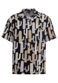 Chemise à manches courtes avec motif de cactus en noir, beige et blanc, avec un devant boutonné et un col. Fabriquée en tissu léger.