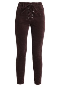 Mörkbruna kordflyktsbyxor med hög midja och framfäste med snörning och metallöglor; slim fit och mjuk textur.