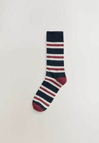 Socken mit marineblauen, cremefarbenen und burgunderroten Streifen, abgerundetem Zehenbereich und geripptem Bund, aus einem weichen Baumwollmischgewebe.