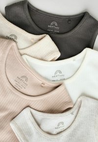 Four ribbed baby tops in beige, light gray, white, and dark gray, featuring rounded necklines and branded labels on the inside.