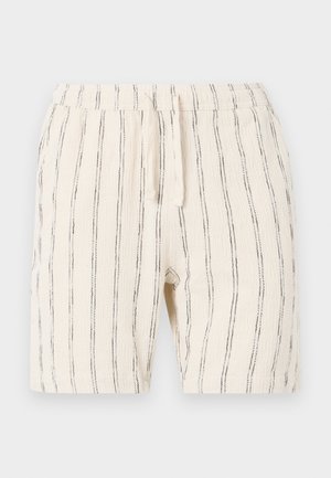 Beige shorts med vertikale sorte striber, med en elastisk talje med snoretræk, lavet af et tekstureret stof.