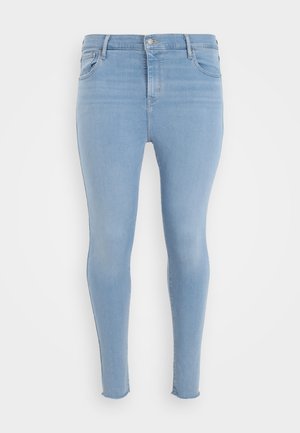 Lichtblauwe skinny jeans met een hoge taille, voorzakken, knoopsluiting en rafelige zomen.