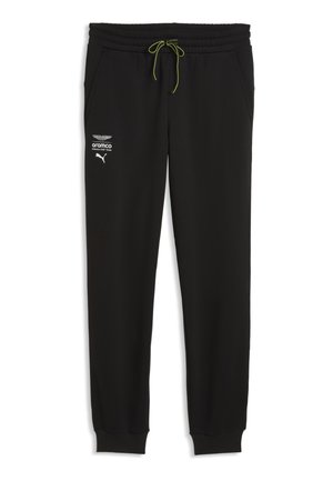 Sorte atletiske joggingbukser med grøn snor og hvide logoer af Aston Martin, Aramco og Puma på venstre lår.