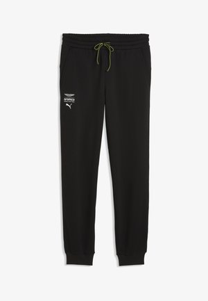 Schwarze athletische Jogginghosen mit grünem Kordelzug und weißen Logos von Aston Martin, Aramco und Puma am linken Oberschenkel.