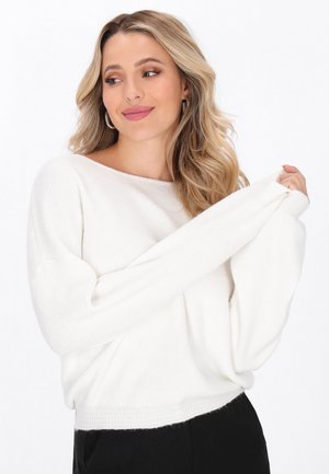 White, knitted sweater with a wide neckline, dropped shoulders, and long sleeves. Soft texture with a ribbed hem detail.