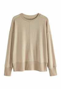 Pull oversized beige avec des poignets et un ourlet côtelés. Texture douce, col rond, et manches inset présentent un design minimaliste.