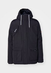 Schwarze gesteppte Jacke mit Kapuze, zwei großen Vordertaschen, einem Reißverschluss und kontrastierenden weißen Kordeln. Strapazierfähiges Material.