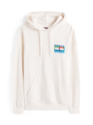 Cream-colored hoodie made of soft fabric, featuring a kangaroo pocket and a blue and green logo patch on the left chest area.