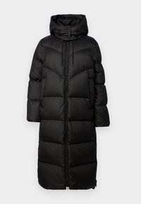 Black puffer coat with a hood, featuring a long design, chevron stitching, front zipper, and adjustable drawstrings. Smooth, insulated fabric.
