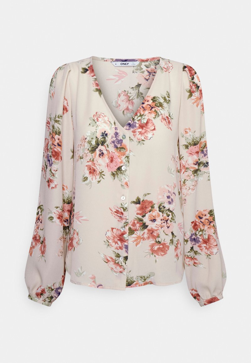 Blusa floral em creme claro com padrões em rosa, roxo e verde. Apresenta um decote em V, mangas longas com franzido e fecho frontal de botões.