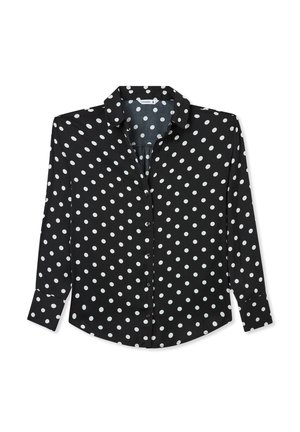 Maglietta nera a maniche lunghe con pois bianchi, chiusura con bottoni davanti, colletto a punta, orlo leggermente arrotondato e tessuto morbido.