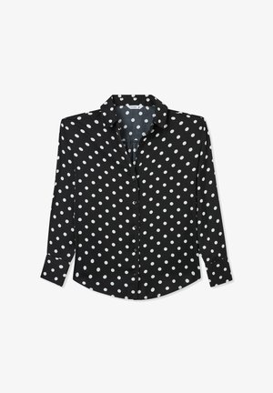 Maglietta nera a maniche lunghe con pois bianchi, chiusura con bottoni davanti, colletto a punta, orlo leggermente arrotondato e tessuto morbido.