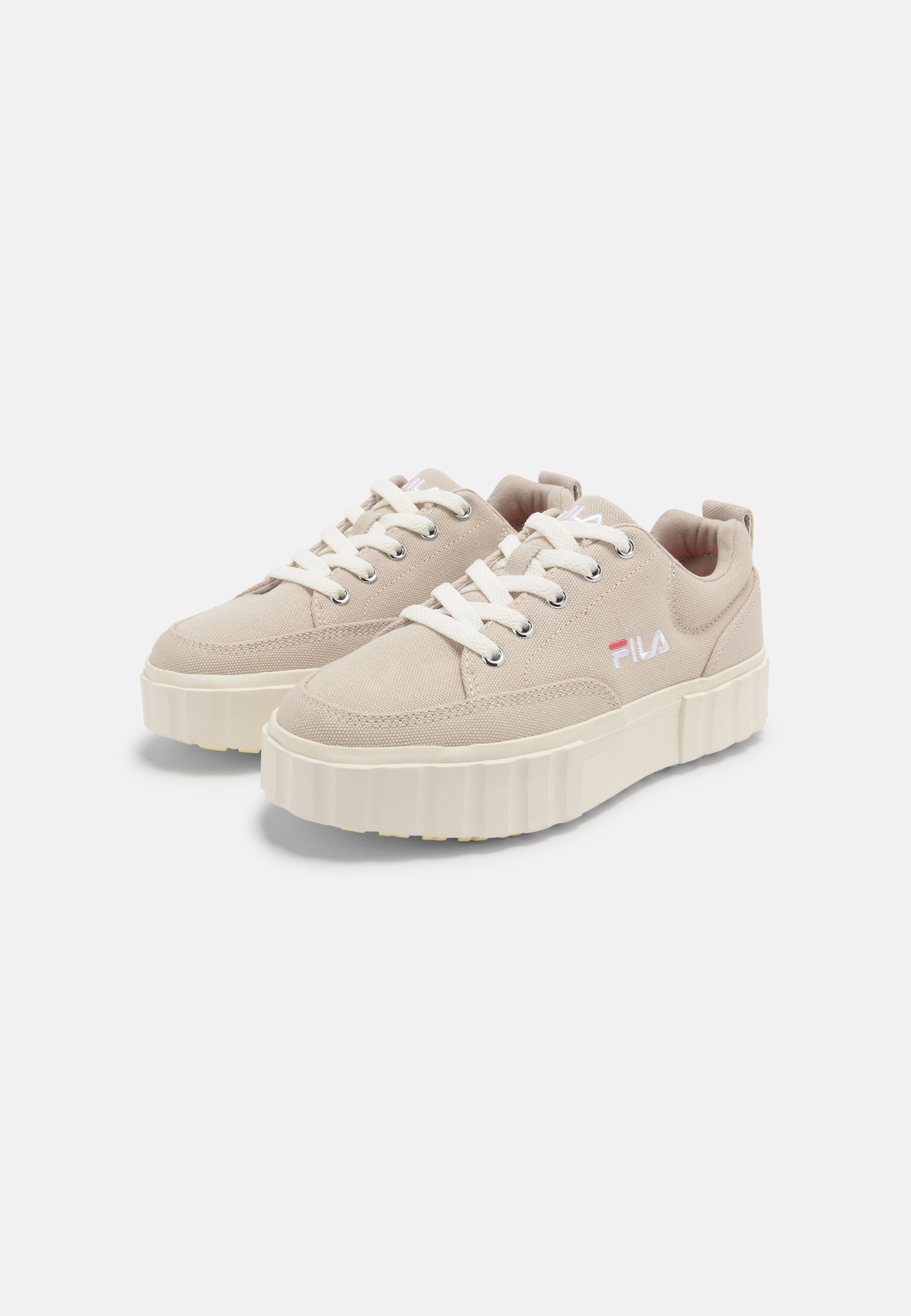 beige fila trainers