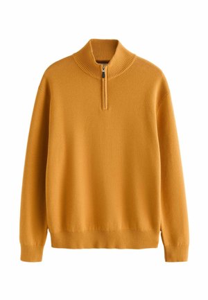 Dijon geltonos spalvos zip-neck megztinis, pagamintas iš minkštos medžiagos. Yra įrengtas bronzinis apykaklė, rankogaliai ir apačia, su laisvu siluetu.