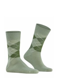 Calzini con motivo argyle verde caratterizzati da una morbida texture lavorata a maglia, diamanti verdi chiari e scuri a contrasto e polsini a coste.