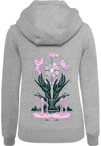 Il felpa grigia presenta una grande grafica sul retro con mani nere che tengono elementi rosa e bianchi, con un design geometrico e una texture morbida.
