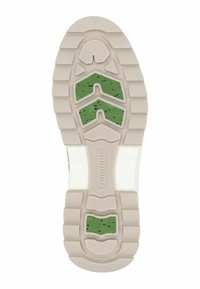 Suola di scarpa con base in gomma beige, caratterizzata da un design testurizzato, accenti verdi e un ritaglio centrale per l'ammortizzazione.