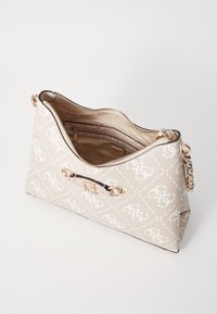 Beige handbag with a diamond pattern, gold hardware, and a zip closure. Features a chain strap and a smooth texture. Interior is lined.