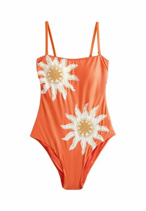 Pomarańczowy strój kąpielowy jednoczęściowy z cienkimi ramiączkami i dwoma dużymi białymi i złotymi haftowanymi wzorami słońca z przodu.