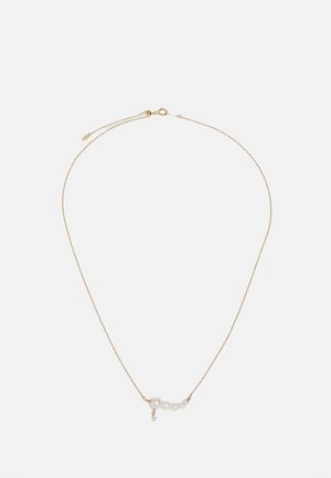 Gold chain necklace featuring four white pearls and a small hanging crystal accent, designed with a delicate and minimalist aesthetic.