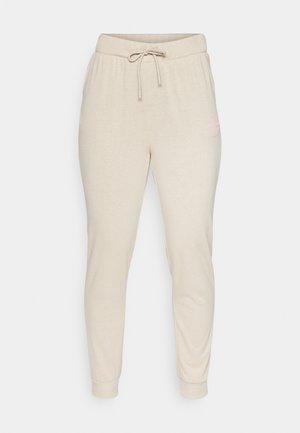 Bēšveidīgi sporta bikses, izgatavotas no mīksta auduma, ar elastīgu jostu un auklu, kā arī ribotām aprocēm. Malā ir neliels rozā logo detaļa.