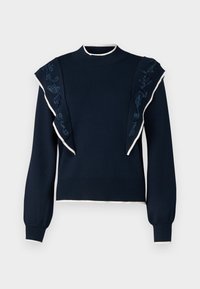 Marineblauwe gebreide trui met rimpelaccenten op de schouders, witte rand en geborduurde details in donkerblauw langs de mouwen. Klein, aansluitend ontwerp.