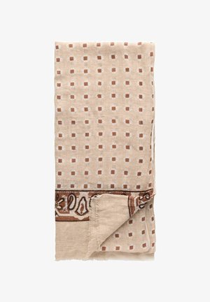 Beige stof foldet, mønstret med små brune og hvide firkanter, med en dekorativ brun kant med paisley og blomsterdesigns.
