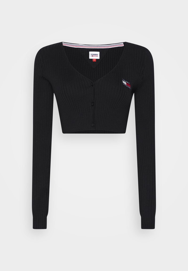 Černý žebrovaný zkrácený kardigan s dlouhými rukávy, třemi předními knoflíky, výstřihem do V a malým logem Tommy Jeans na hrudi.