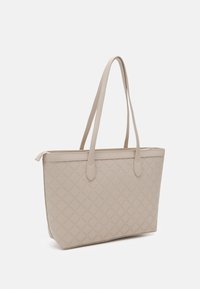 Beige tote bag with quilted pattern, smooth synthetic material, two long handles, and a zip closure at the top.
