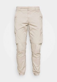 Lichtbeige cargobroek van een katoenmix. Voorzien van steekzakken, elastische boorden en een knoopsluiting. Soepele textuur en ontspannen pasvorm.