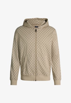 Beżowa bluza z kapturem na zamek błyskawiczny z wzorem nawzajem przeplatających się kół na całej powierzchni, kieszeniami z przodu, ściągaczami przy rękawach i u dołu oraz przyszytym kapturem.