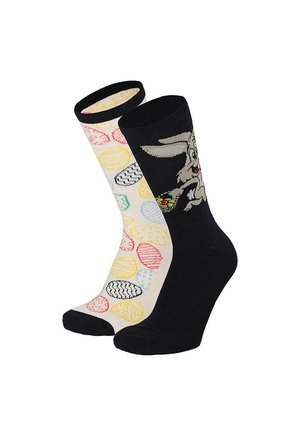 One black sock with a cartoon rabbit holding an Easter egg, and one white sock with colorful patterned Easter eggs.