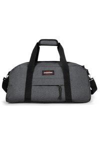 Šedá sportovní taška s černými popruhy, vyrobená z texturované látky. Obsahuje přední zipovou kapsu a nastavitelný ramenní popruh. Zobrazeno logo Eastpak.