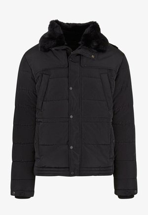 Mustmust väikerind, millel on faux karusnaha krae, nupplukud, kaks esimest taskut ja horisontaalne tikand.