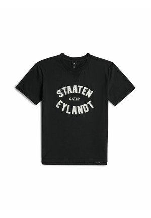 T-shirt noir à manches courtes avec col rond, avec un texte blanc "STAATEN EYLANDT" et un plus petit "G-STAR" au centre devant.