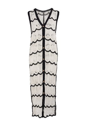 Ärmelloses langes weißes Strickkleid mit schwarzem gewelltem Saum und einer Reihe brauner Knöpfe in der Mitte vorne.