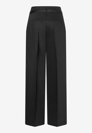 Black high-waist wide-leg trousers with rear welt pockets and a fabric belt loop, shown from the back on a plain white background.