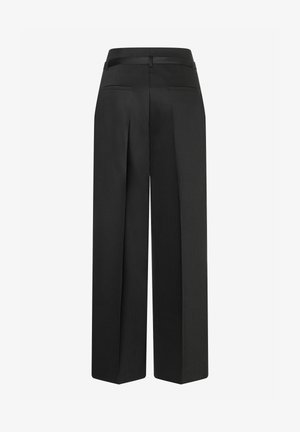 Black high-waist wide-leg trousers with rear welt pockets and a fabric belt loop, shown from the back on a plain white background.