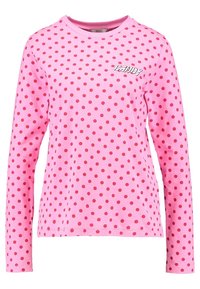 Pitkähihainen vaaleanpunainen puuvillapaita, jossa on punaisia pilkkuja ja pyöreä kaula-aukko. Vasemmassa rintapielessä on pieni logo. Sileä pinta.