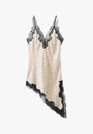 Abito sottoveste in raso beige con pois neri, bordatura in pizzo nero sullo scollo e orlo asimmetrico, con sottili spalline regolabili.