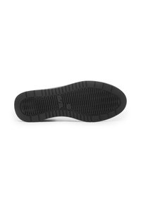 Black rubber shoe sole with textured grip pattern and molded sections for flexibility. Features a flat design and rounded toe area.