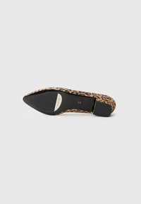 Leopard print flat shoe with a pointed toe, black sole, and smooth texture. Accents include a small heel and branding on the insole.