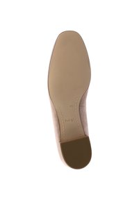 Beige suede shoe sole featuring a textured rubber base, smooth surface, and embossed logo. Contoured shape for comfort and style.