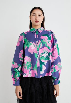 Floral button-up shirt with purple, pink, and green patterns. Features a collared neck and puffed sleeves. Textured fabric.