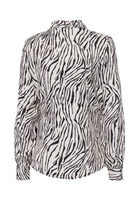 Blouse à motif zèbre, avec des manches longues, un col et un tissu léger en noir et blanc. Texture douce avec des poignets froncés.