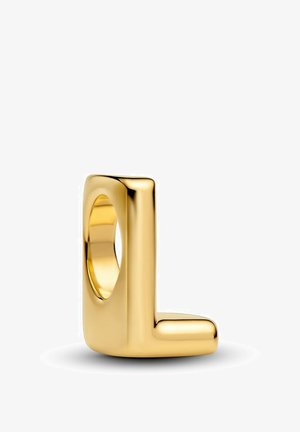 Bague en or au design géométrique en forme de L. Surface lisse avec une finition polie, présentant un centre creux et un style minimaliste.