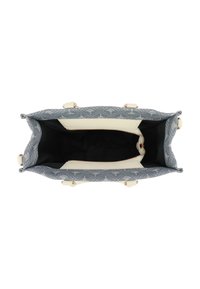 Sac fourre-tout en tissu bleu ciel avec un motif texturé, doublure intérieure crème, fermeture éclair et accents en rose doré. Vue ouverte par le dessus.