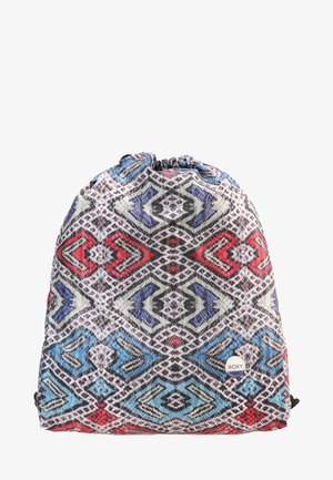 Sac à cordon avec des motifs géométriques complexes en rouge, bleu, blanc et noir, et un petit logo circulaire Roxy près du bas à droite.